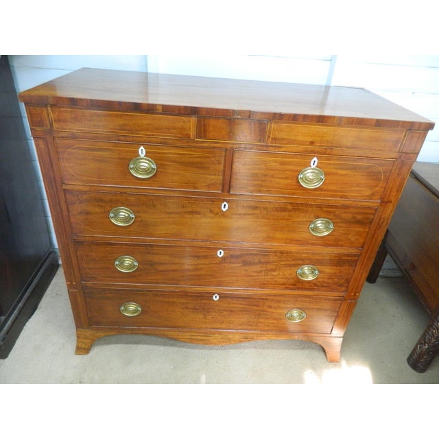 This Victorian Mahogany Chest of Drawers is a stunning piece of antique furniture, crafted from high-quality mahogany wood...