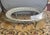 An exceptional, grand-scale vintage Hollywood Regency oval cocktail table featuring an Italian hand-forged and cast...