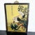 This elegant Chinese reverse-painted glass artwork features a pair of herons or egrets perched gracefully among pine...