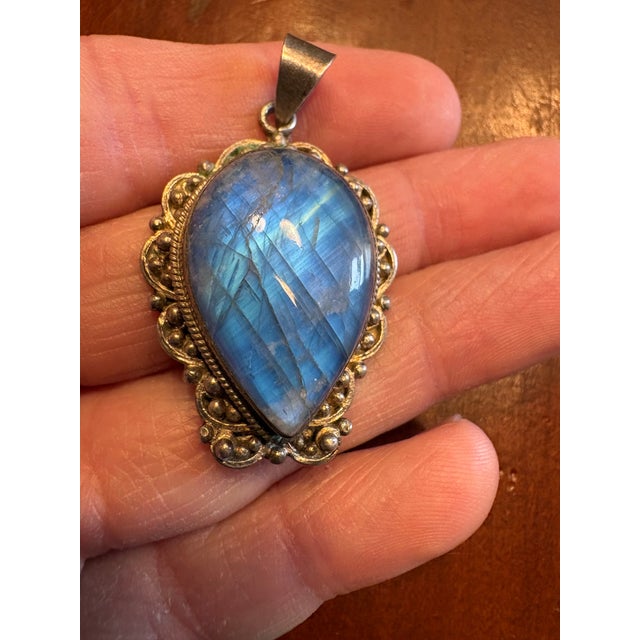 Beautiful blue labradorite and sterling silver pendant with sterling flourished edge.