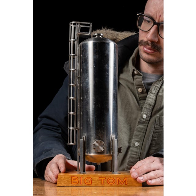 Vintage salesman sample model of a single industrial storage tank nicknamed “Big Tom.” The detailed miniature was created...