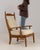 This piece presents as a armchair, distinguished by natural oak carved frame, cream upholstered seat/back. It was made in...