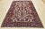 This authentic, semi-antique, traditional, tribal Heriz rug is hand-knotted with an all-wool pile on a cotton foundation....