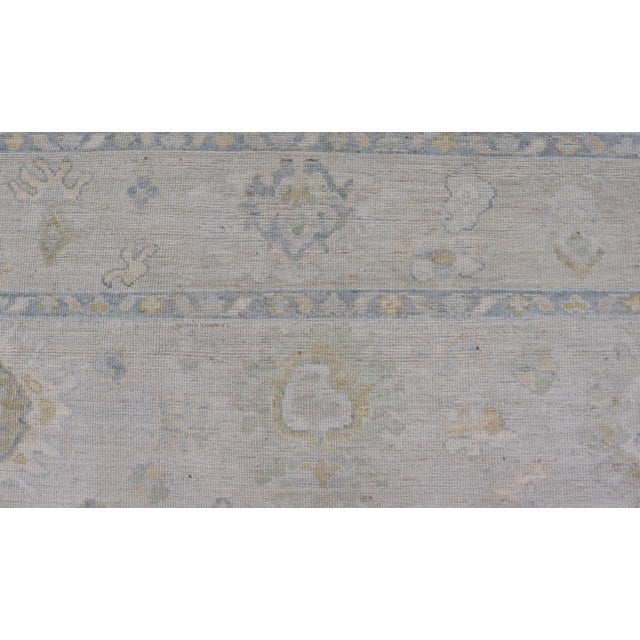 Modern Tribal Oushak With a Cream Border and Light Gray-Blue Background For Sale In Atlanta - Image 6 of 13