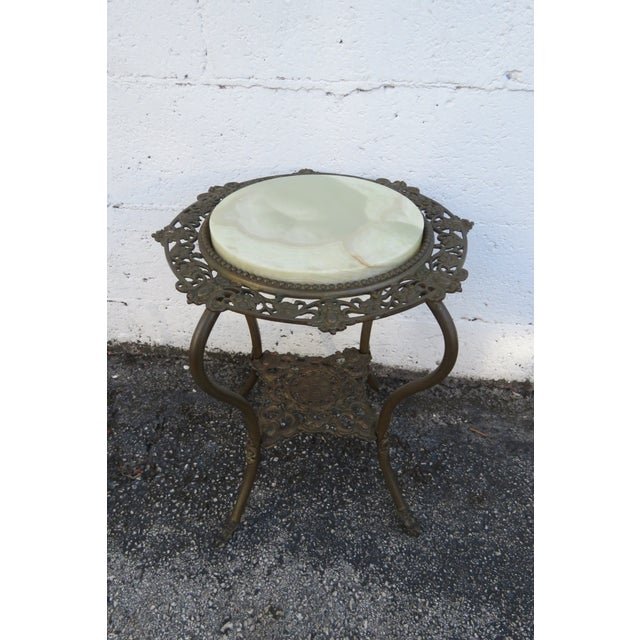 This gorgeous Flower Statue Stand is made out of Antique Brass Metal and Stone. The piece has Victorian design from the...