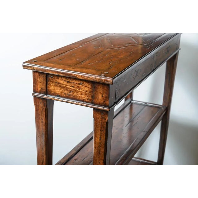 Narrow Console with two drawers. Carved details on drawer fronts. Distressed finish'