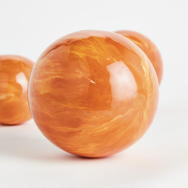 In a clever use of enameled iron, this lightweight orb is painted by hand. A refined, luminous design, each one prettier...
