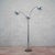 This three-light floor lamp represents an authentic example of Italian modernism, attributed to the renowned designer...