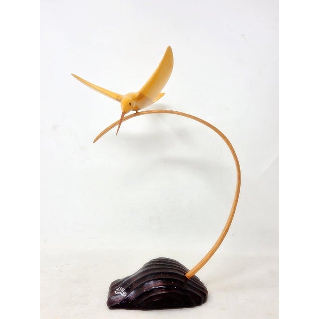 Vintage 1990s hand-carved hummingbird sculpture by wood carving artist L.S. "Mac" McLaughlin, a notable artisan recognized...