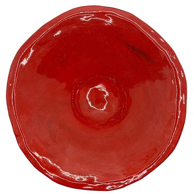 An exquisite handcrafted studio pottery ceramic pedestal bowl in a vibrant deep cherry red glaze. This piece exudes...
