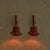A pair of Italian wall sconces from the 1970s, combining bent bamboo, woven rattan, and warm, saturated color. Each sconce...