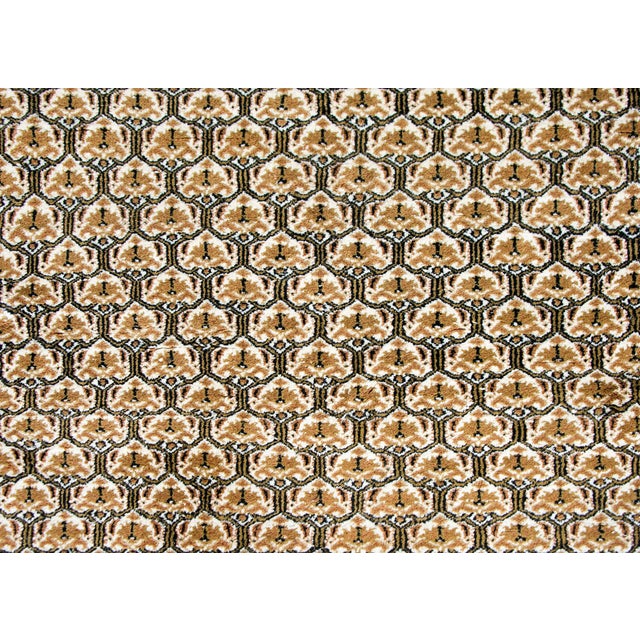 A wonderful late 20th century Pakistani Chi Chi rug with an all-over floral trellis pattern surrounded by a complex border...