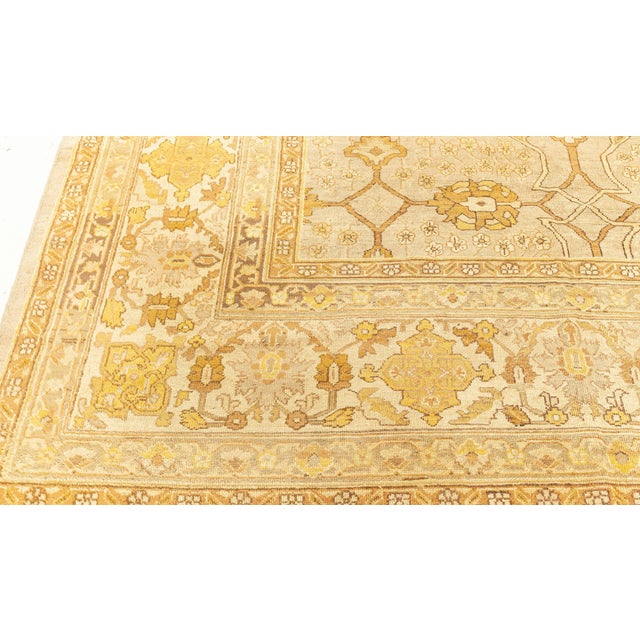 Antique Indian rugs often include large scale patterns depicting mythical beasts and Persian-inspired floral motifs....