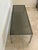 Amazing Mid-Century Modern rectangular glass coffee table, featuring a polished chrome steel frame and a dark smoked glass...