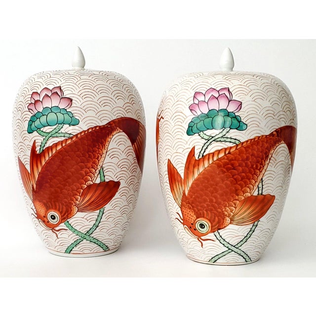 Offering a a pair of large 14" hand painted vintage Chinese porcelain ginger jars, circa Mid 20th Century. These jars are...