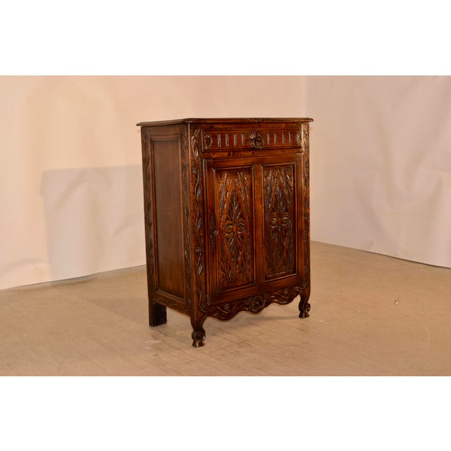 19th century oak buffet from France with a beveled edge around the top with nice hand carved details on the corners and...