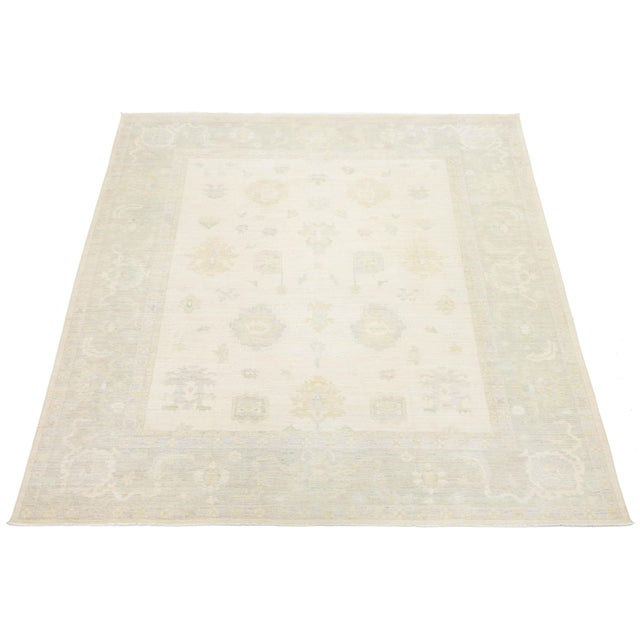 Elevate your space with this sophisticated Modern Oushak-style rug, hand-crafted from premium wool. It features a spacious...