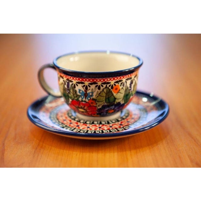 This ceramic cup with a saucer, featuring a 0.2-liter capacity, is perfect for enjoying coffee and tea. All decorations...
