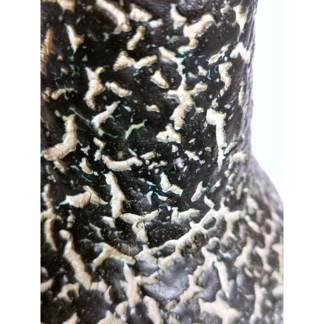 This small designer ceramic vase from the 1970s features a cracked pattern surface with lava glaze. Signed by renowned...