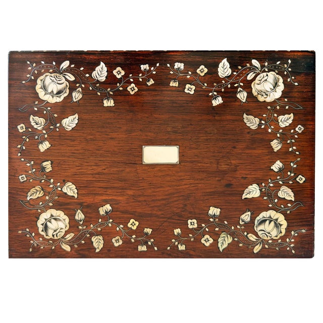 Rose Wood Box with Inlaid Mother of Pearl Floral Motive on a Mahogany Handmade Four Leg Stand This box was passed by my...