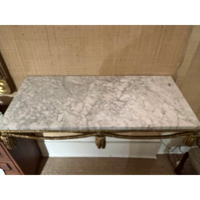 A particularly nice Italian tassel wall console adorned with a marble top. A striking piece. Probably custom.