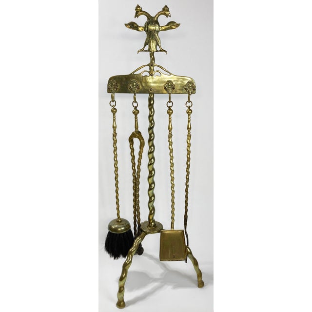 Antique handmade brass fireplace tools featuring hand-forged barley twist style handles and a heavy three prong footed...