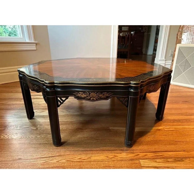 Offered is a mahogany octagon shaped coffee table by Kindel furniture. This piece features painted chinoiserie details and...