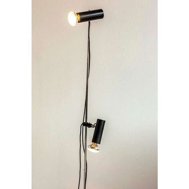 This floor lamp, model 1055, was designed by Gino Sarfatti for Arteluce in the 1950s. It is made from stainless steel and...