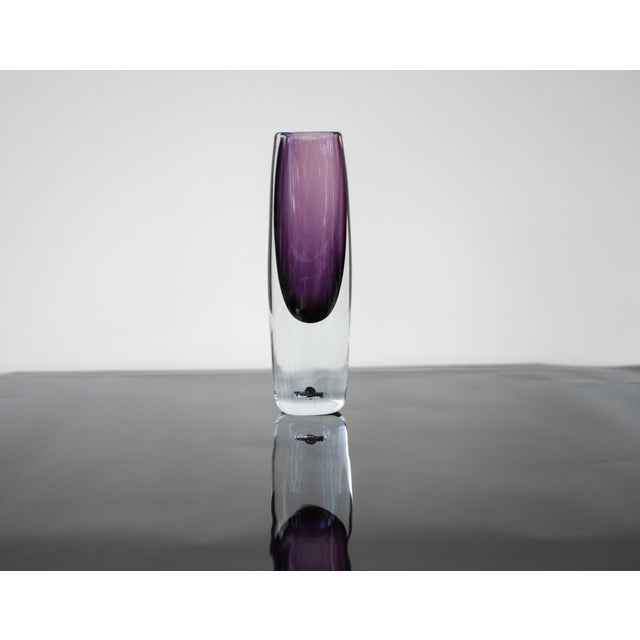 A fantastic and rather large handblown vintage art sommerso glass vase in a beautiful purple color, design and signed by...
