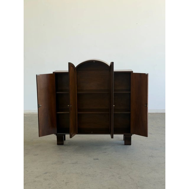W46.25 D11.5 H51.5 A beautifully restored Art Deco waterfall cabinet. This piece has been fully refinished to highlight...