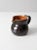 A vintage studio pottery creamer pitcher, hand-crafted and signed by the artist. The sculptural form features a rich dark...