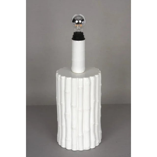 Iconic large Mid-Century white glazed ceramic lamp with white parchment lampshade. It was produced in Italy during the...
