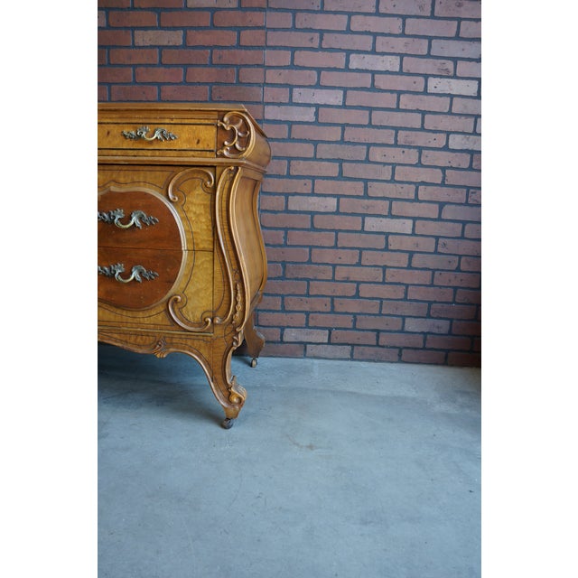 Amazing antique chest of drawers with mirror. Finely crafted by Joerns Brothers Furniture, with incredible veneer work and...