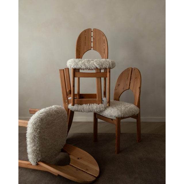 A warm, characterful set of four vintage Danish pine dining chairs, designed in a sculptural Scandinavian spirit...