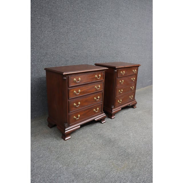 Pair of Henkel-Harris four-drawer bedside chests or bachelor chests in genuine mahogany, crafted in the Georgian style....
