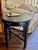 An exceptional antique round accent table showcasing a striking blend of classic Chinoiserie aesthetics and excellent...