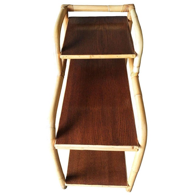 Restored Mid-century rattan side table with 3-tier mahogany tops and loop arching table legs. The top 3rd tier is perfect...