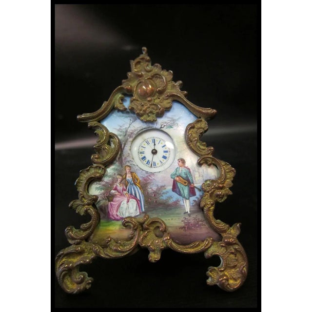 This fine vintage miniature in a decorative bronze frame features a detailed hand painted enamel scene with costumed...