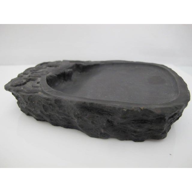 Chinese scholars calligraphy inkstone. Features a flat grinding surface that slopes into a pool for collecting the liquid...