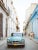 A car driving through the streets of Havana, Cuba 2013. Unframed Havana Alley by Erich Mcvey Print, 12" x 16"