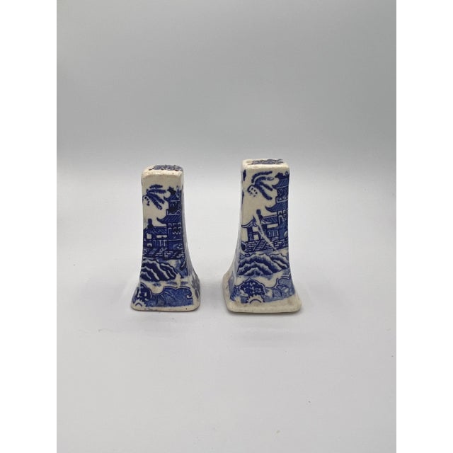 Original "Blue Willow" Japan Salt & Pepper Shakers, roughly 3.5” Tall 1.75” wide 1.75” deep. Same hole pattern on top, one...