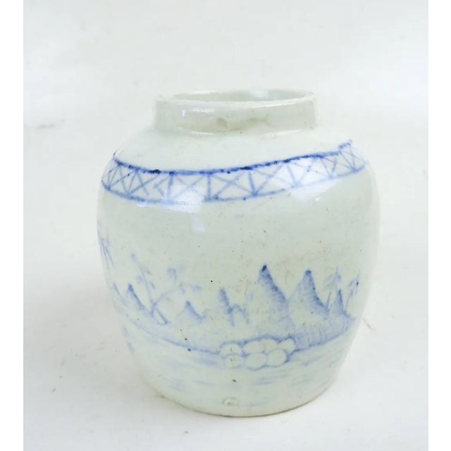 Small late 19th century blue and white hand painted chinoiserie pottery storage jar. Painted all around with pastoral...