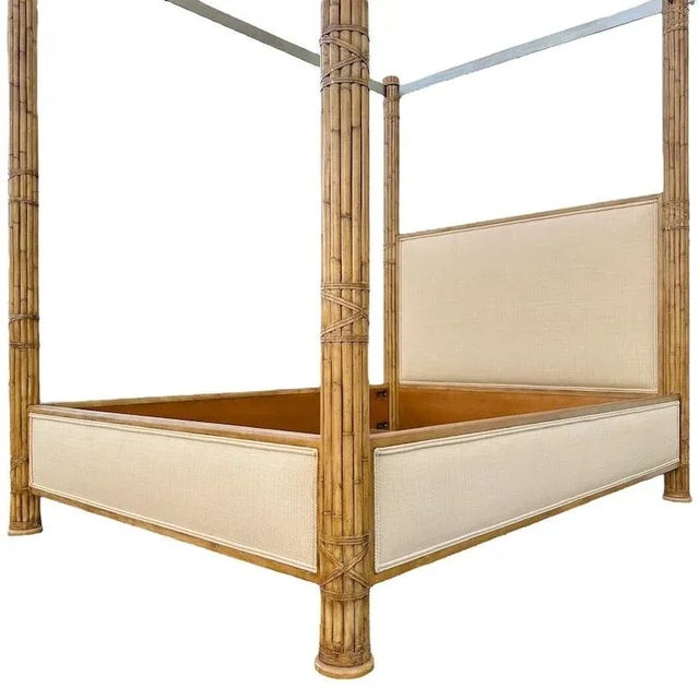 Vintage queen size bed features large bamboo posts with unique steel canopy and cream linen upholstery. It is in very good...