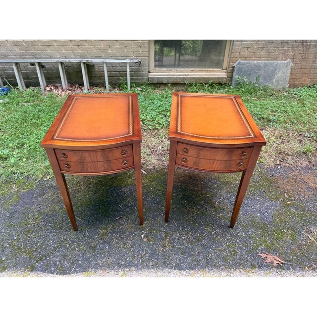Pair of Federal style leather top flame mahogany side tables Dovetail joint construction, metal handles ,tapered legs...