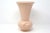 A vintage, ceramic vase by Camark, with a flared form and embossed spiral designs around the base. Good condition; no...