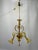 This murano glass chandelier features a structure suspended by a gold-plated metal chain connected to a brass ceiling...