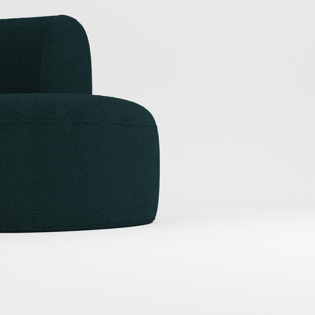 Hug sofa is defined by clean, simple lines and a distinctive armrest detail. The armrest, half overlapping the seat...