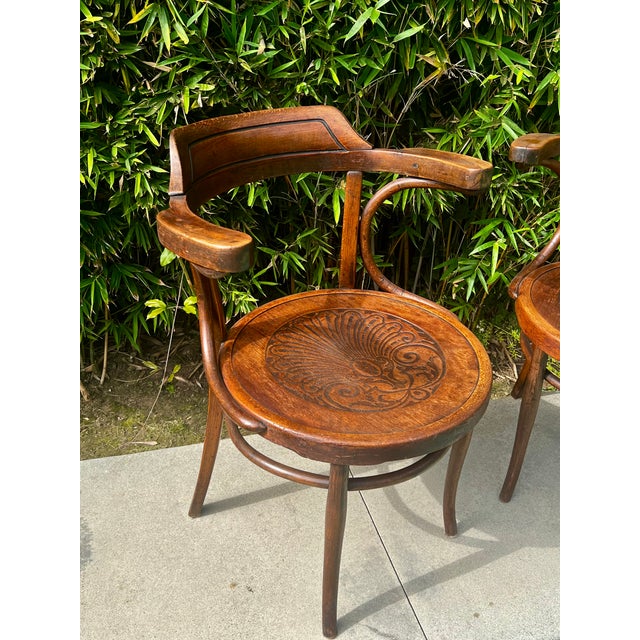Pair of Antique Bentwood Armchairs Style is similar to the Thonet 233. The embossed seat is indicative of Fischel from...