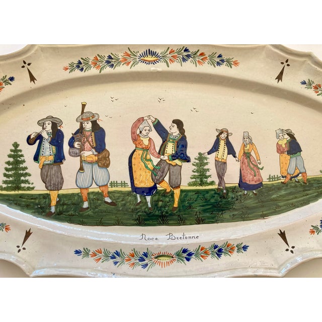 A fabulous antique HB Quimper large dfish platter with detailed hand painted musicians and Breton couples dancing in...