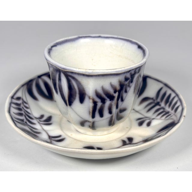 Rare & Original Antique Flow Black Cup and Saucer for your consideration. The saucer measures approx. 6 1/4 inches in...